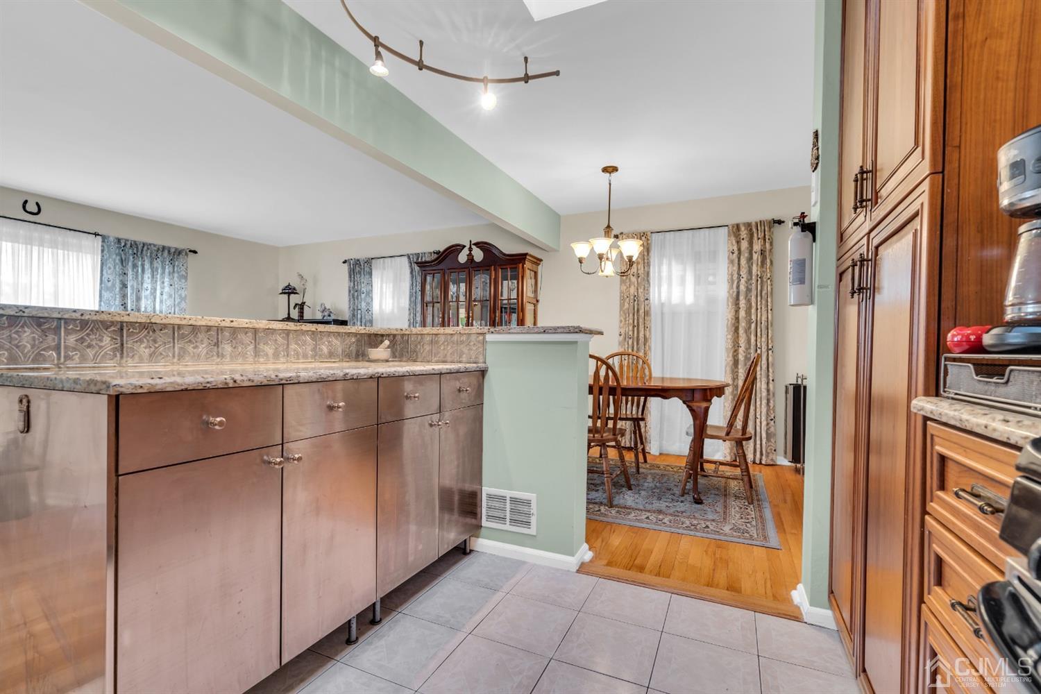 69 Stony Road Edison, NJ 08817 - Photo 12 of 33 a kitchen with stainless steel appliances granite countertop a refrigerator and a sink