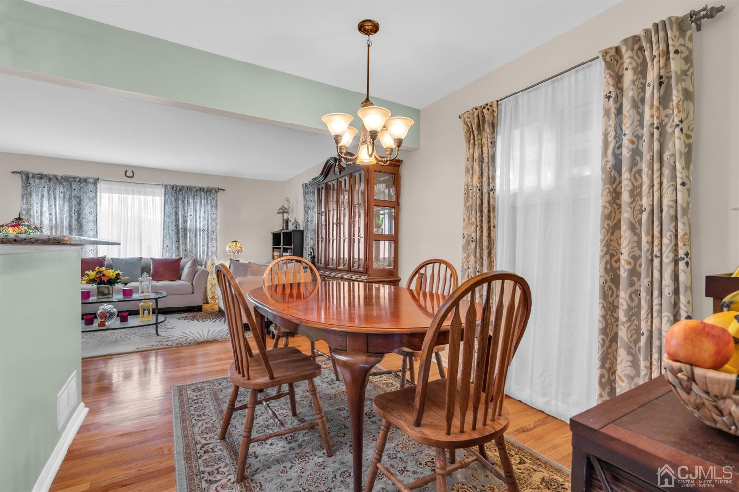 69 Stony Road Edison, NJ 08817 - Photo 14 of 33 a view of a dining room with furniture window and wooden floor