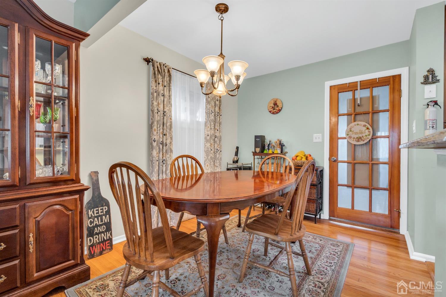 69 Stony Road Edison, NJ 08817 - Photo 15 of 33 a view of a dining room with furniture window and wooden floor