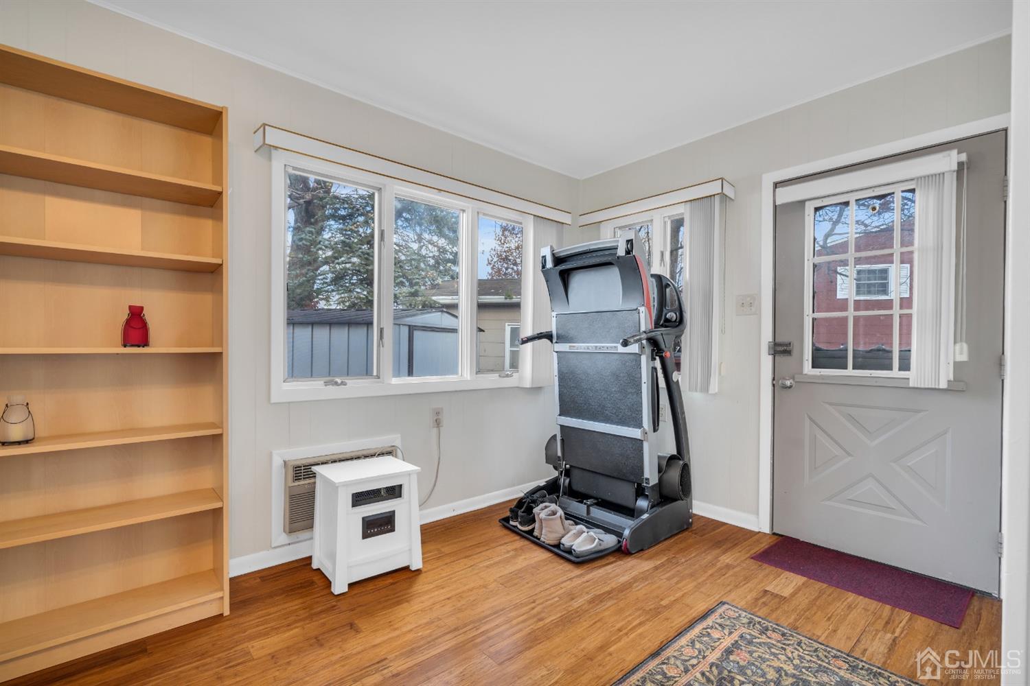 69 Stony Road Edison, NJ 08817 - Photo 19 of 33 a view of workspace with wooden floor and windows
