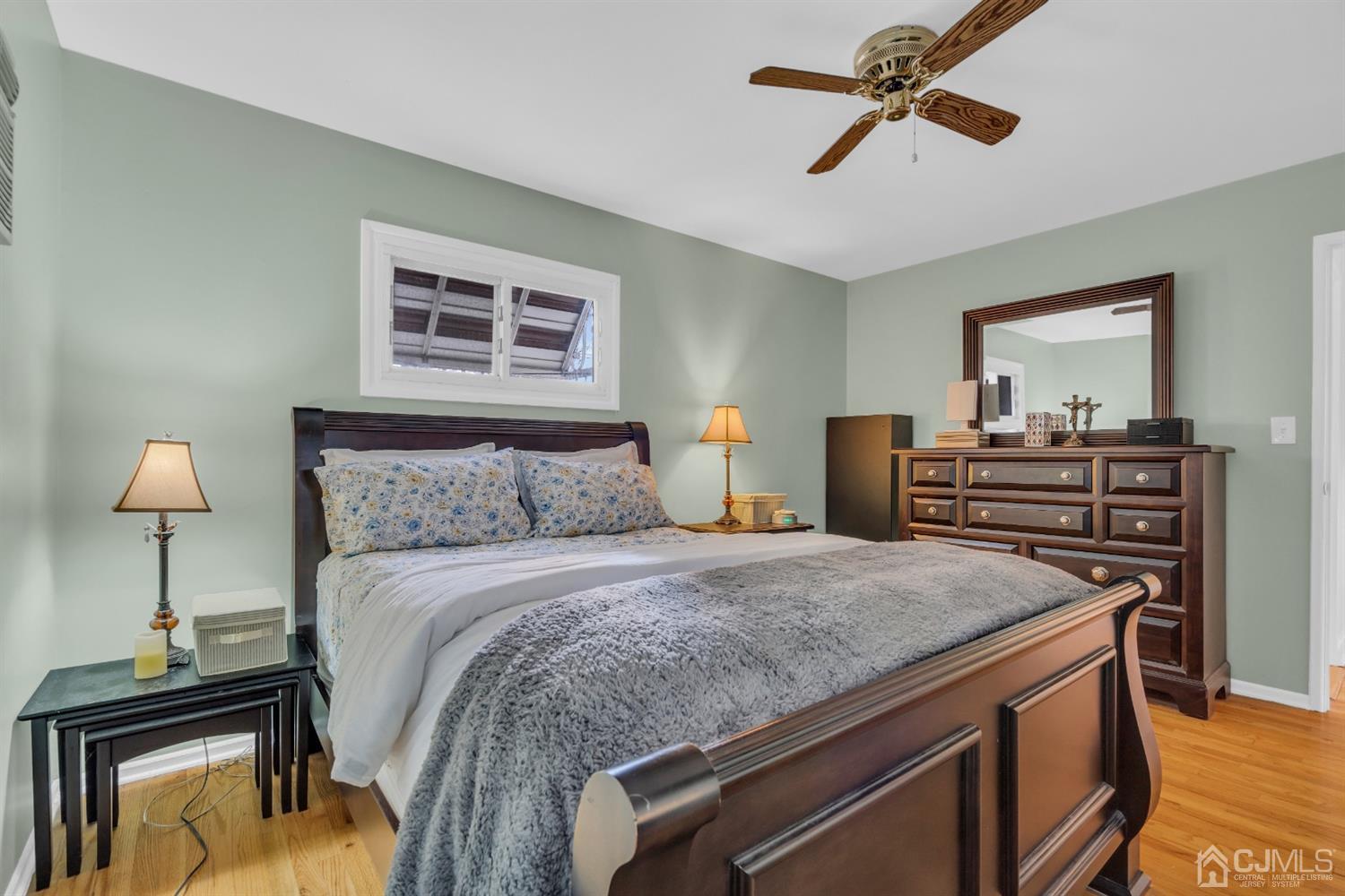 69 Stony Road Edison, NJ 08817 - Photo 20 of 33 a bedroom with a bed and dresser with chair