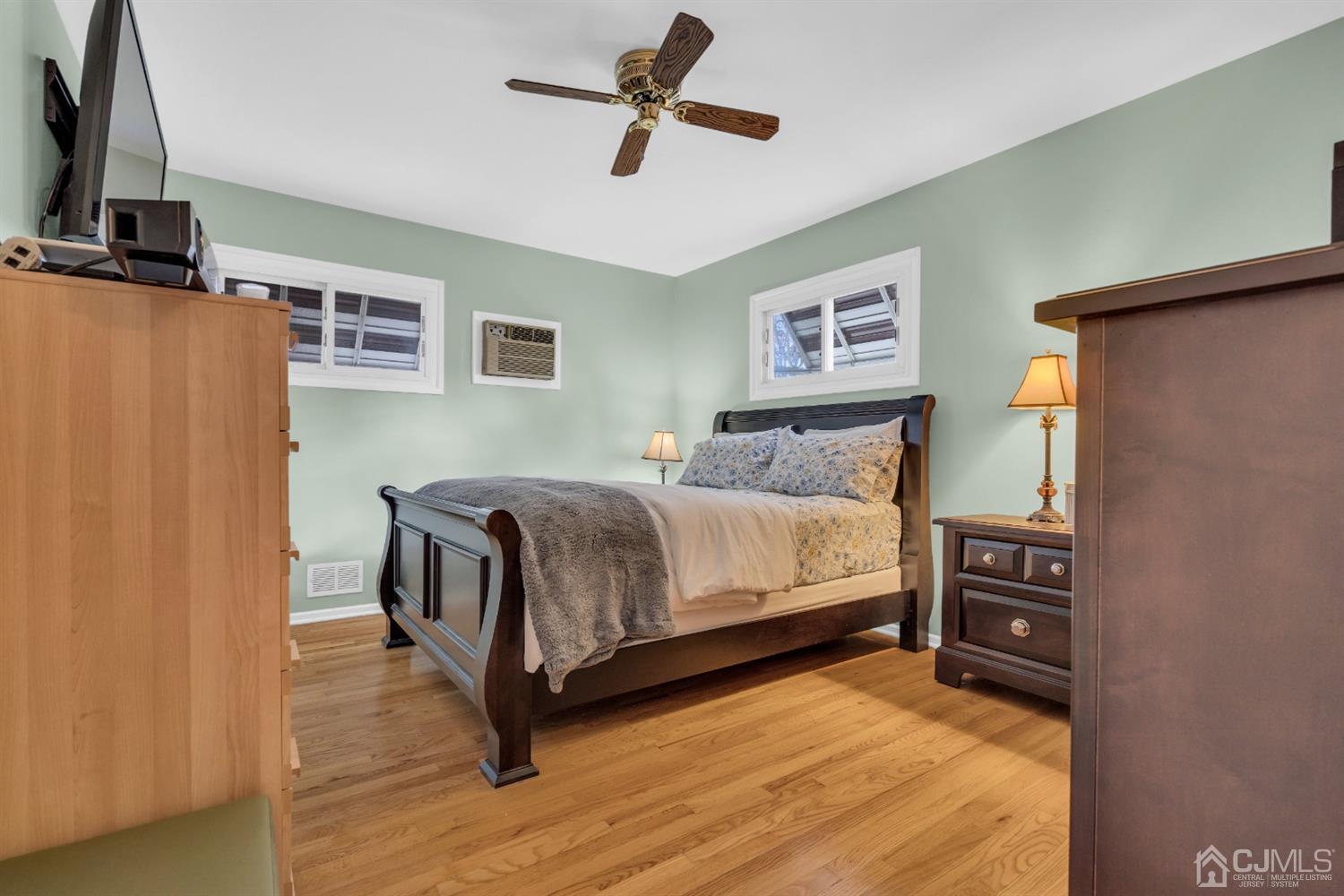 69 Stony Road Edison, NJ 08817 - Photo 21 of 33 a bedroom with a bed and wooden floor