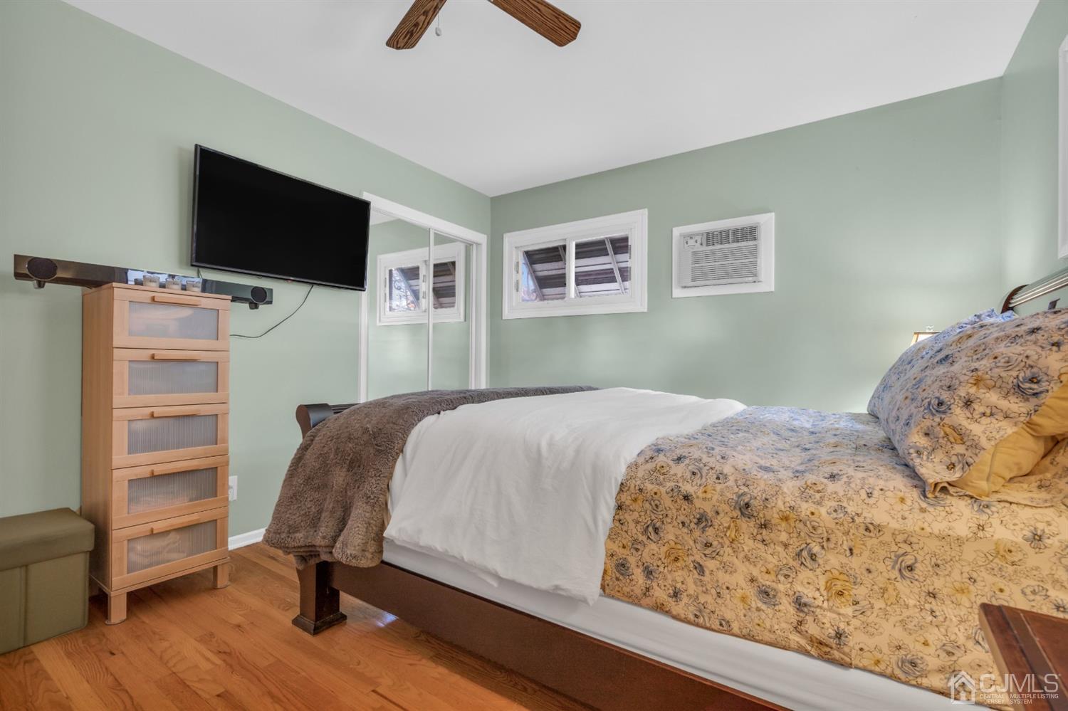 69 Stony Road Edison, NJ 08817 - Photo 24 of 33 a bedroom with a bed and a flat screen tv