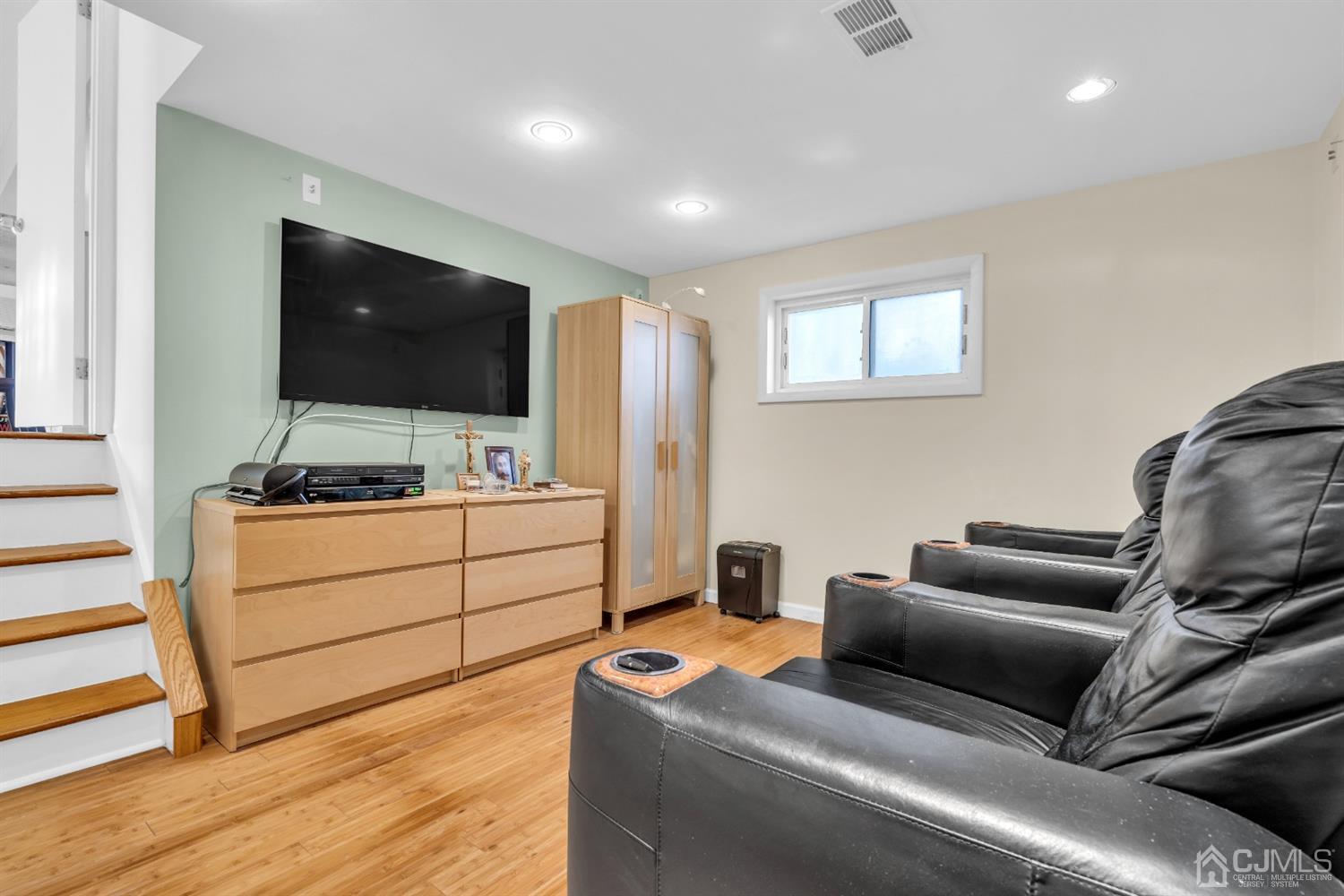 69 Stony Road Edison, NJ 08817 - Photo 26 of 33 a room with furniture and a flat screen tv