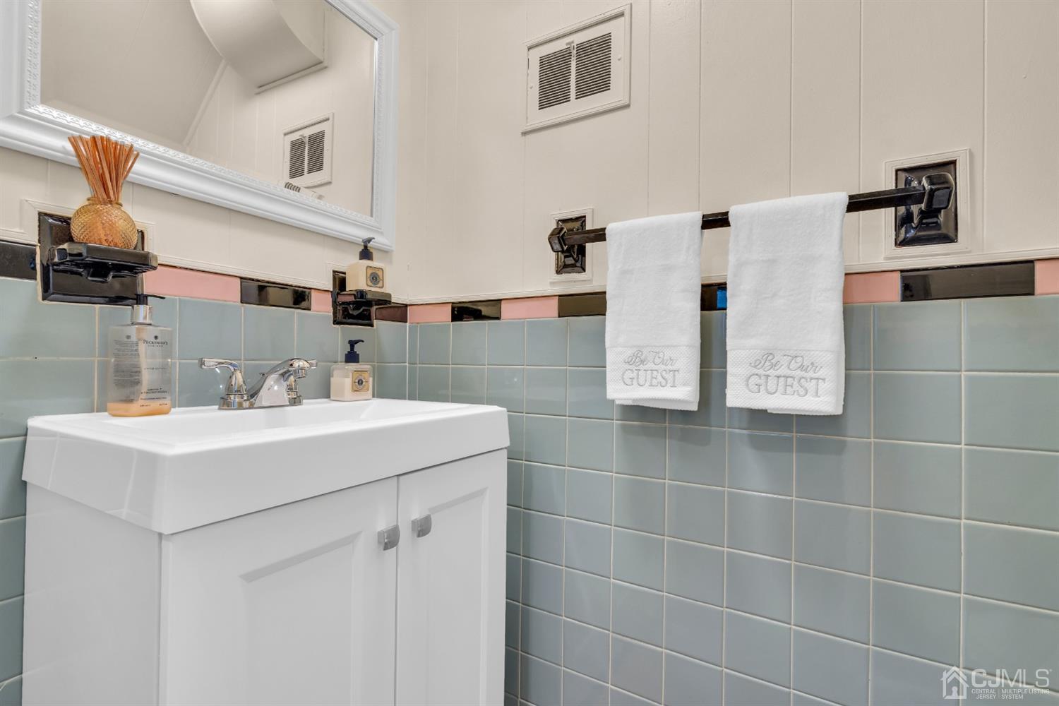 69 Stony Road Edison, NJ 08817 - Photo 27 of 33 a bathroom with a sink and a mirror