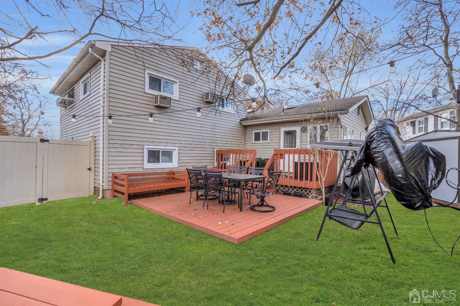 69 Stony Road Edison, NJ 08817 - Photo 28 of 33 a backyard of a house with table and chairs