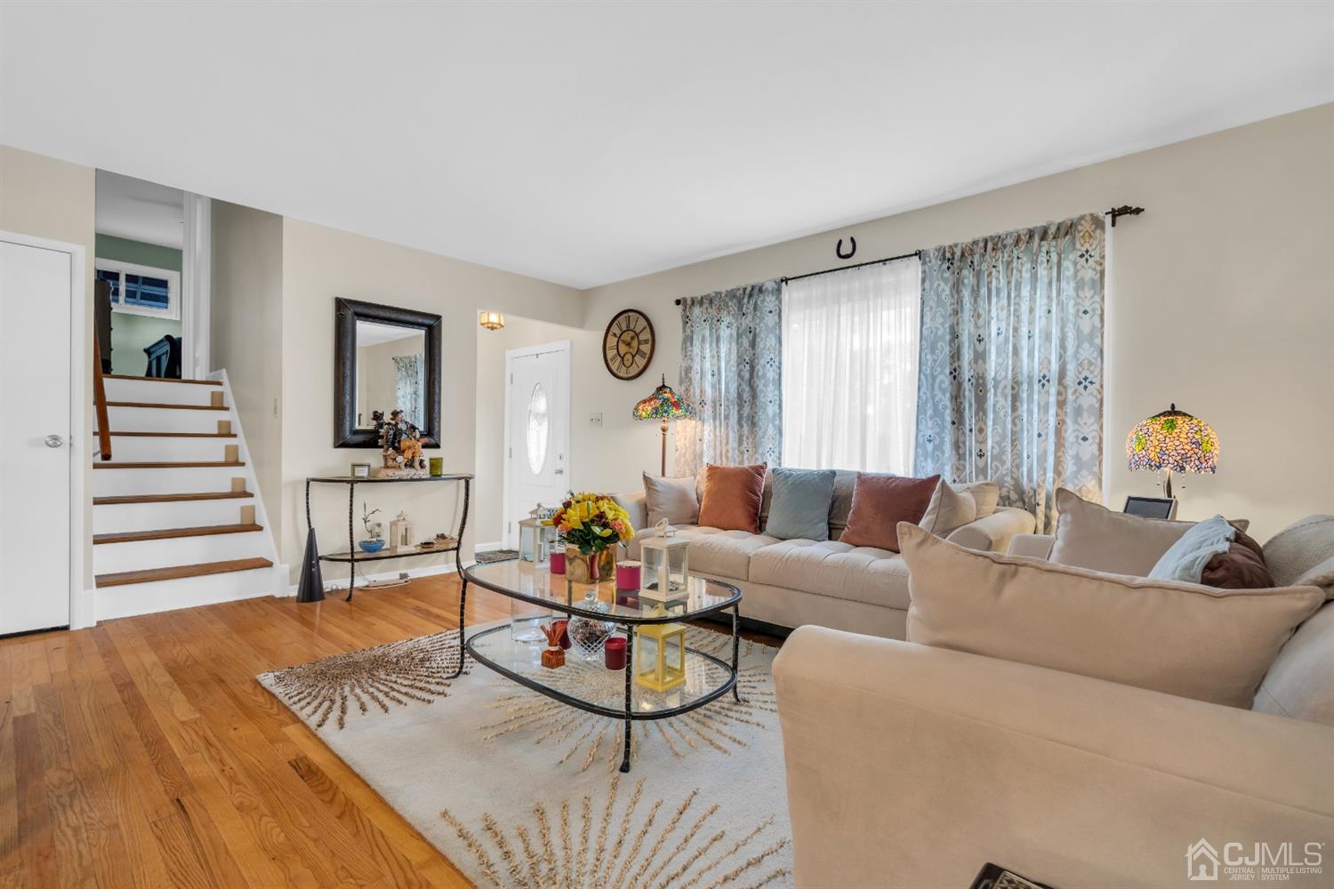 69 Stony Road Edison, NJ 08817 - Photo 6 of 33 a living room with furniture and wooden floor