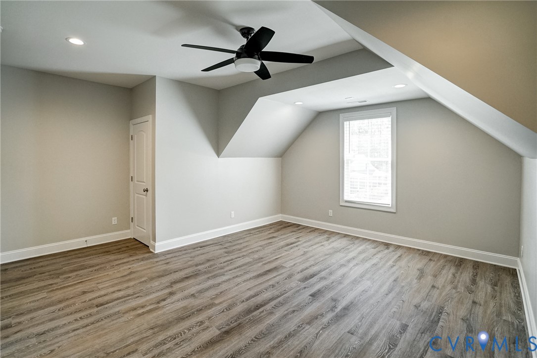 4669 Woburn Road Providence Forge, VA 23140 - Photo 44 of 78 an empty room with wooden floor and windows