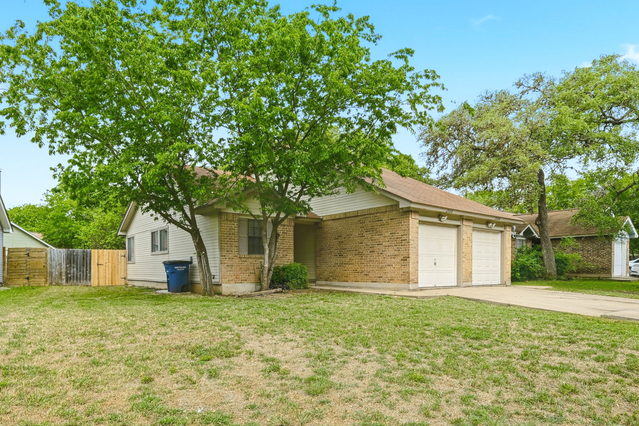 2511 Howellwood Way, Unit A Austin, TX 78748 - Photo 2 of 16 a house with a tree in front of it