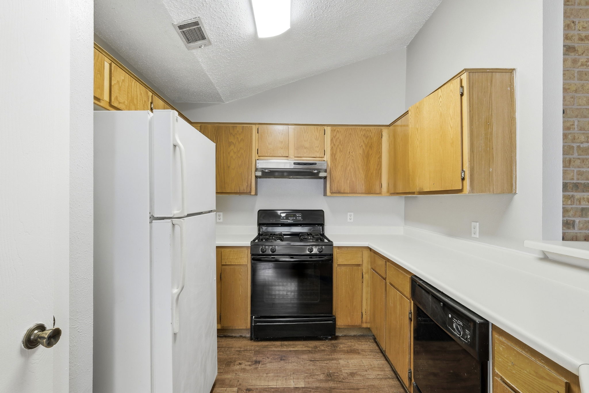 2511 Howellwood Way, Unit A Austin, TX 78748 - Photo 7 of 16 a kitchen with a stove and a refrigerator