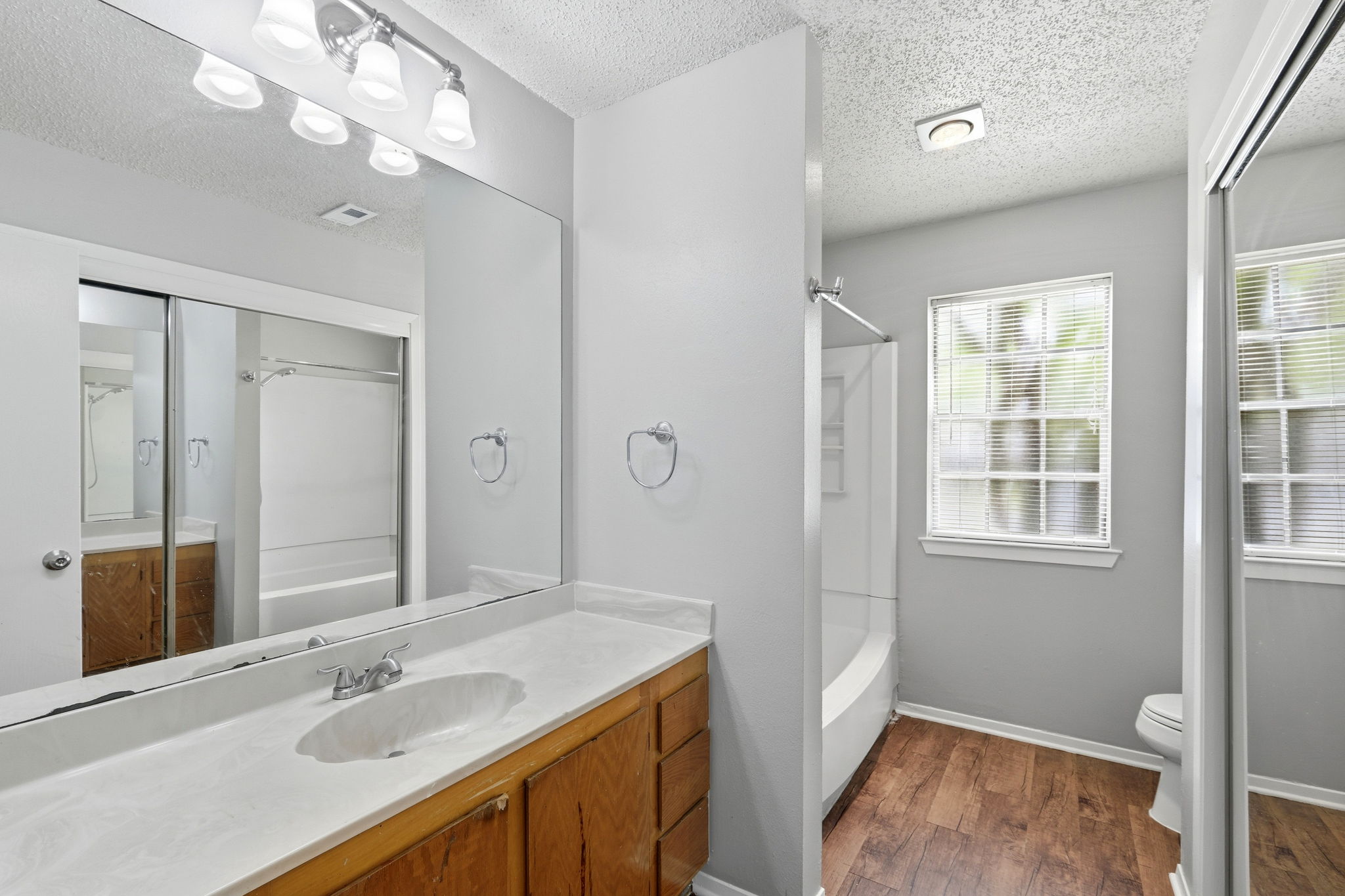 2511 Howellwood Way, Unit A Austin, TX 78748 - Photo 10 of 16 a bathroom with a sink a vanity and a mirror