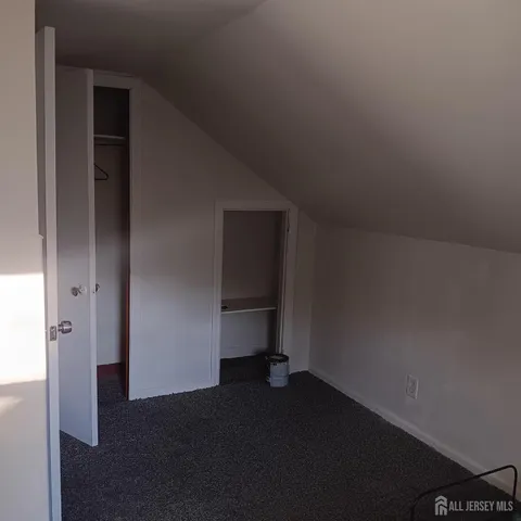 a living room with a chair and a window