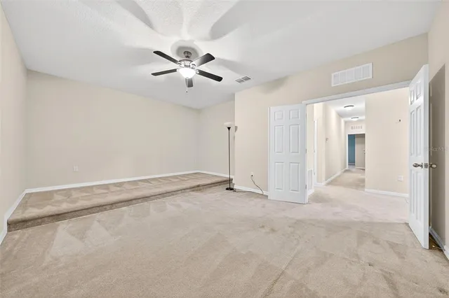 a view of an empty room with a window