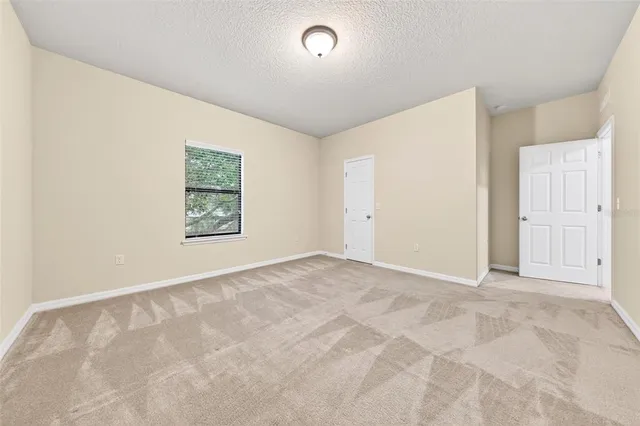 a view of a big room with carpet