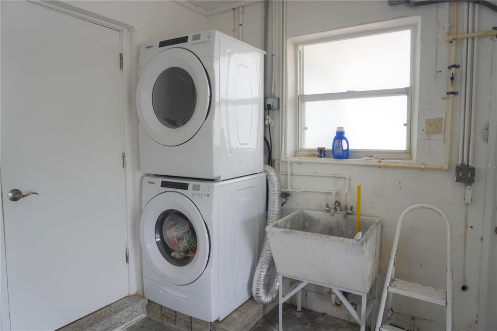 104 163rd Avenue Redington Beach, FL 33708 - Photo 17 of 22 a utility room with sink dryer and washer
