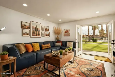 a living room with furniture and a large window
