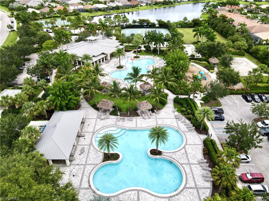 2701 Citrus Street Naples, FL 34120 - Photo 32 of 39 a patio with glass top table and chairs