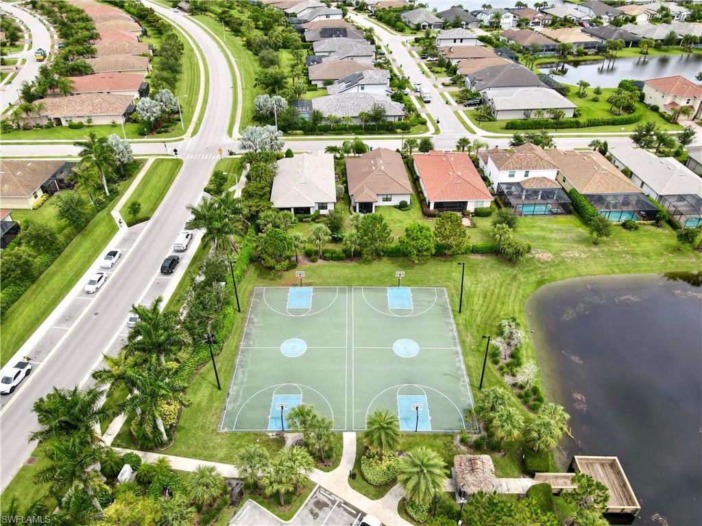2701 Citrus Street Naples, FL 34120 - Photo 35 of 39 an aerial view of a house with a garden and lake view