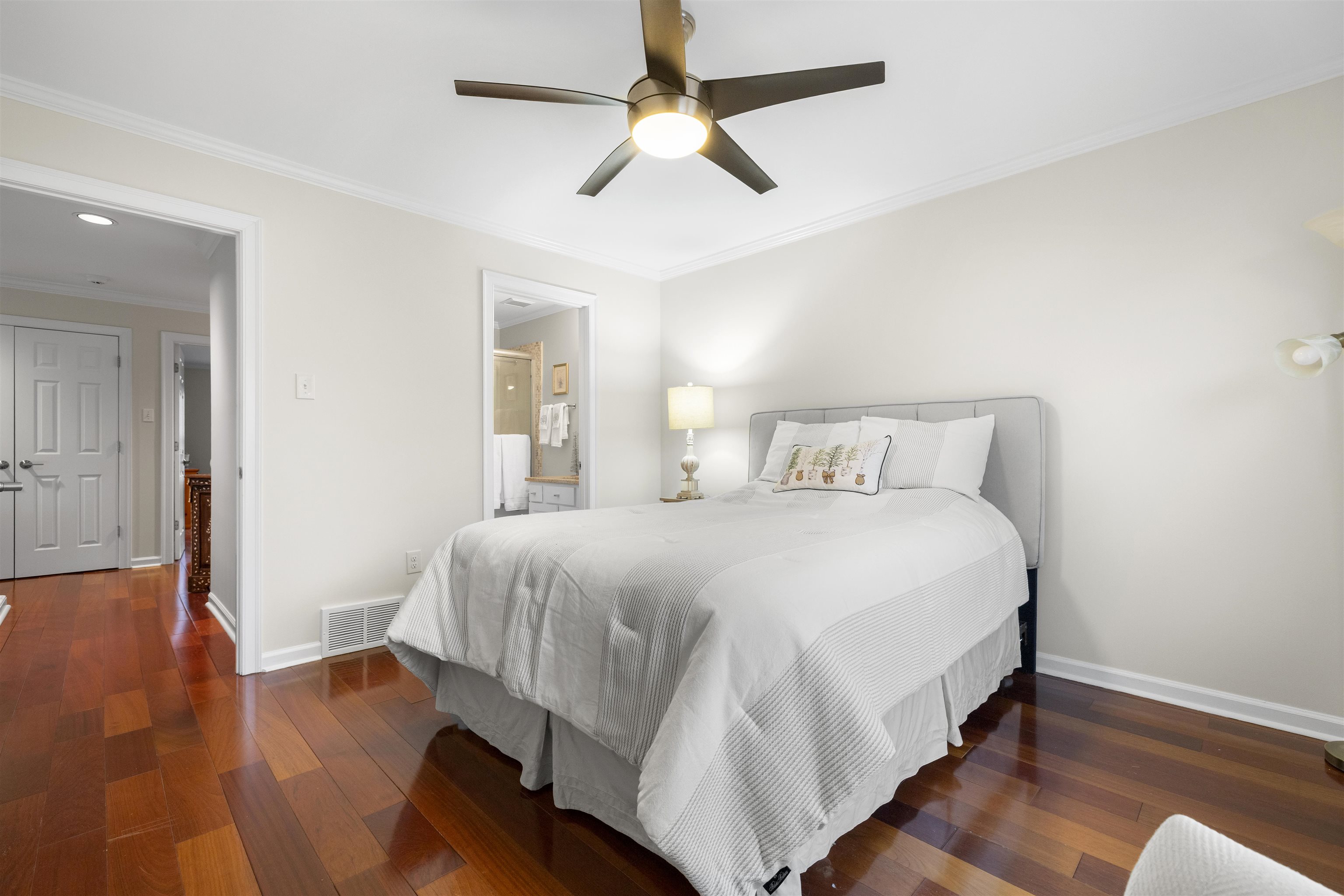 2163 Houston Pass Collierville, TN 38139 - Photo 19 of 30 a bedroom with a bed and wooden floor