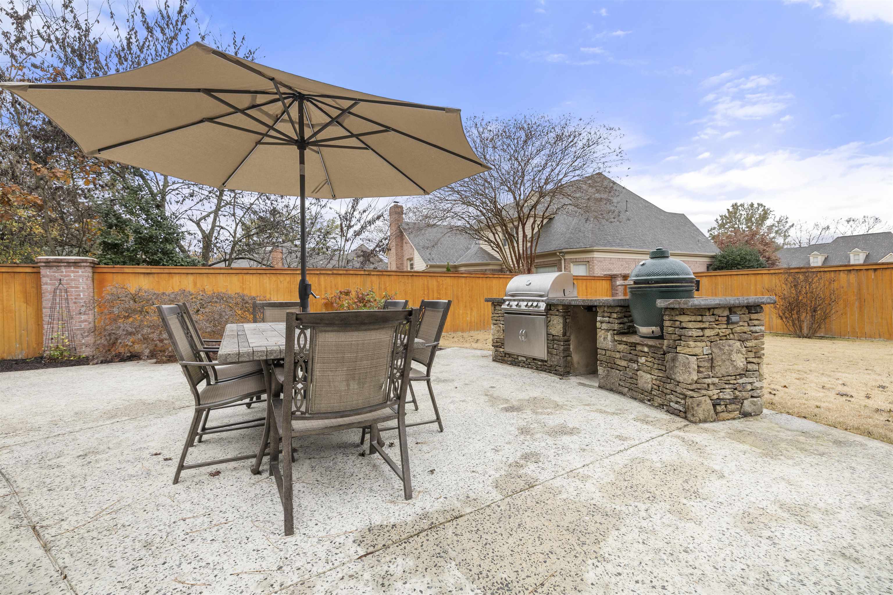 2163 Houston Pass Collierville, TN 38139 - Photo 27 of 30 a view of a swimming pool with a table and chairs under an umbrella