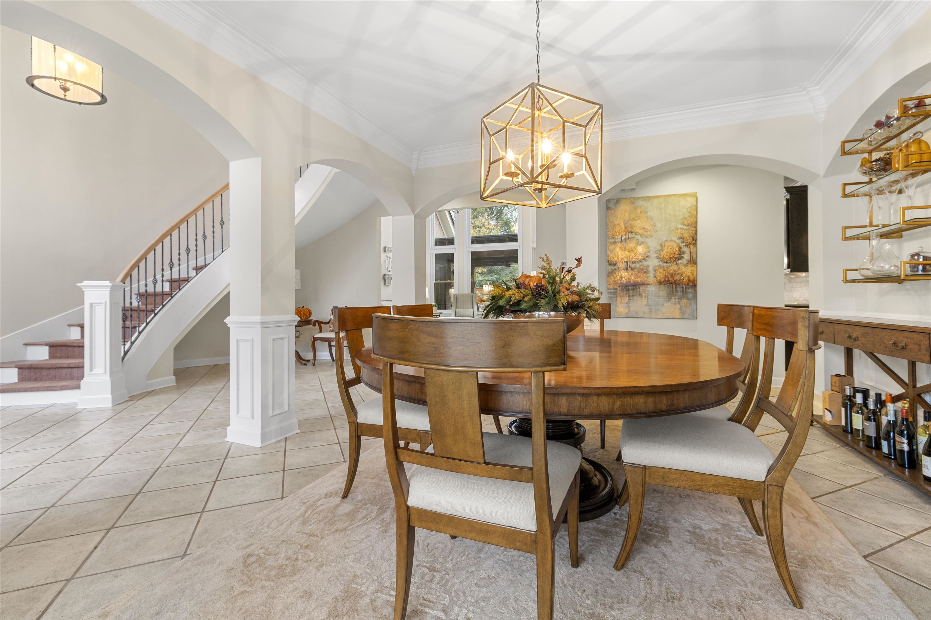 2163 Houston Pass Collierville, TN 38139 - Photo 4 of 30 a dining room with wooden floor a chandelier a wooden table and chairs