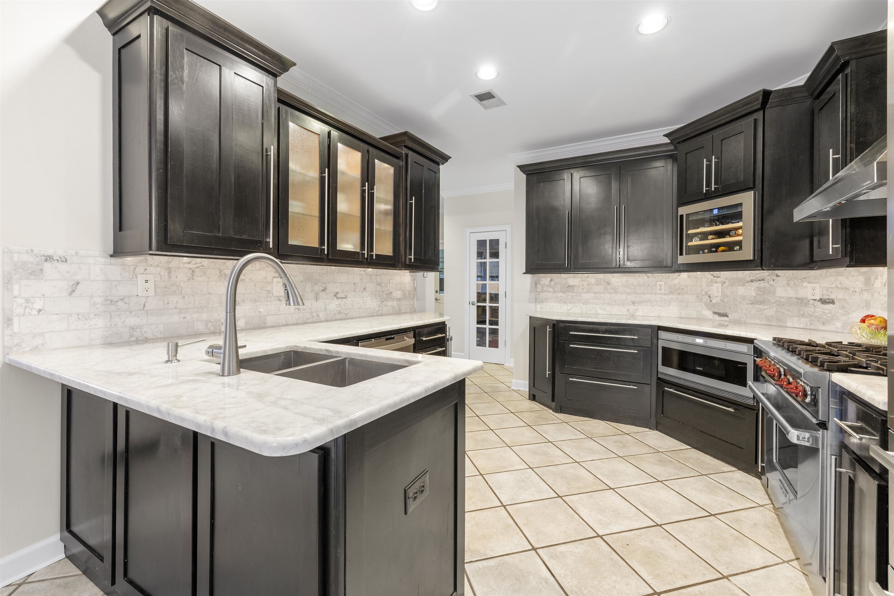 2163 Houston Pass Collierville, TN 38139 - Photo 7 of 30 a kitchen with stainless steel appliances granite countertop a sink stove and refrigerator
