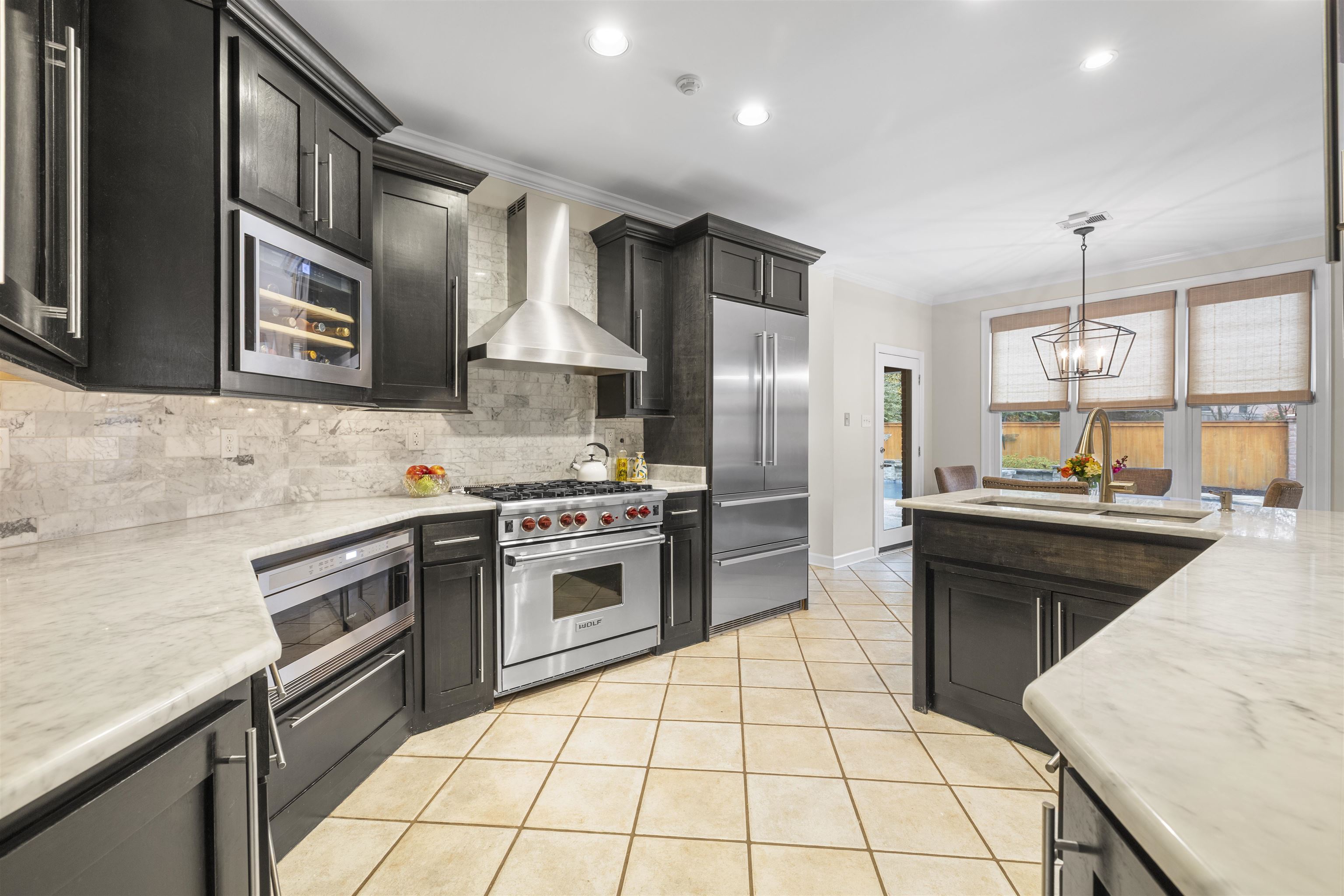 2163 Houston Pass Collierville, TN 38139 - Photo 8 of 30 a kitchen with stainless steel appliances a sink stove and refrigerator