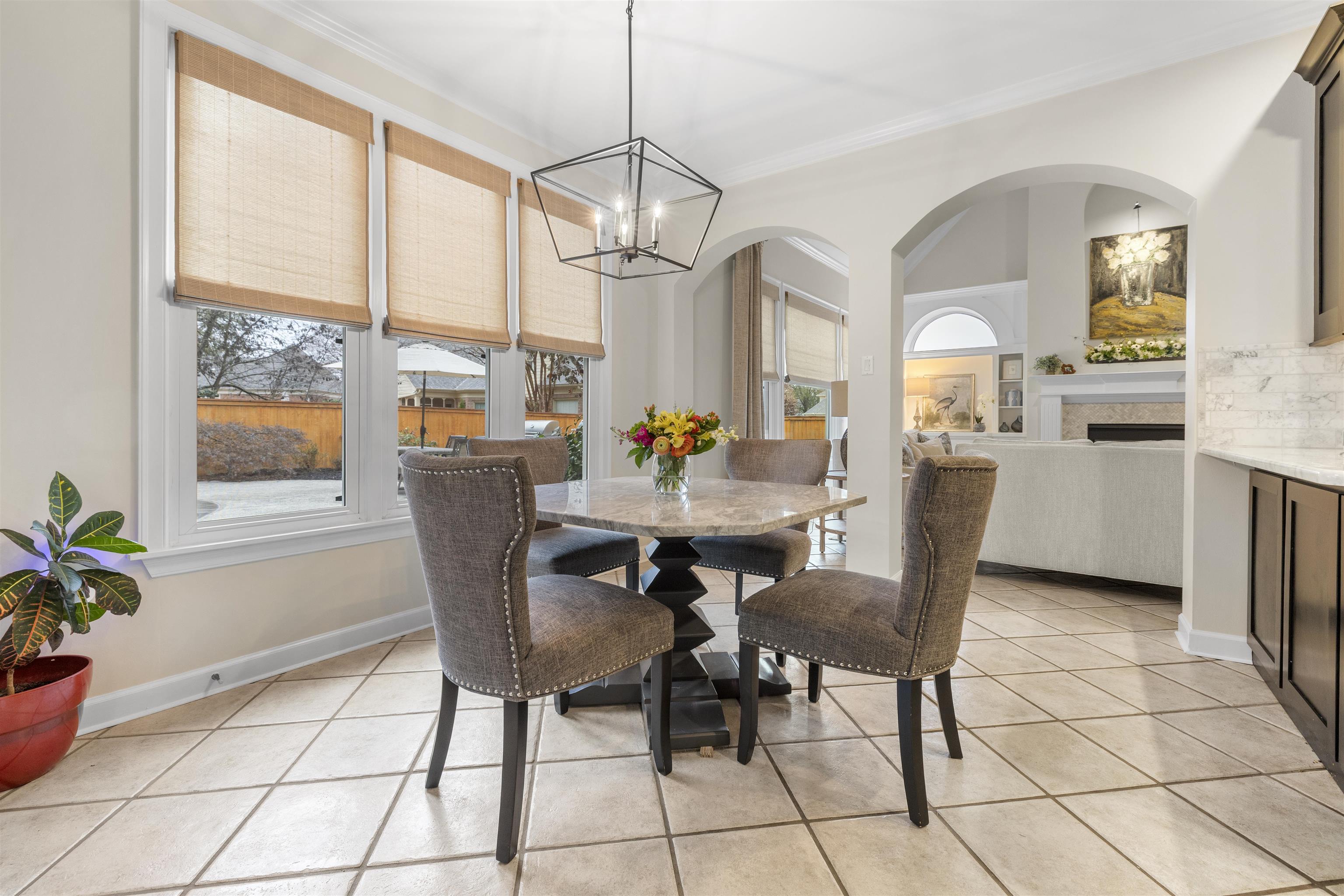 2163 Houston Pass Collierville, TN 38139 - Photo 9 of 30 a dining room with furniture a chandelier and window