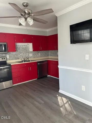 a view of kitchen cabinet and microwave