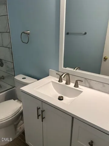 a bathroom with a sink and a toilet