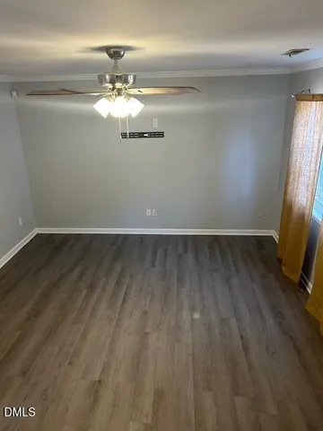 a view of a livingroom with wooden floor