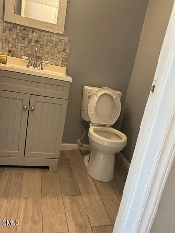 a bathroom with a toilet and a sink