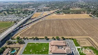 a view of a swimming pool and a back yard
