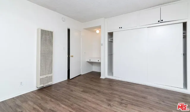 a view of a bathroom with a shower and a toilet