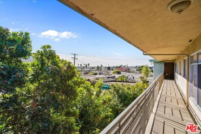 a view of balcony with wooden floor