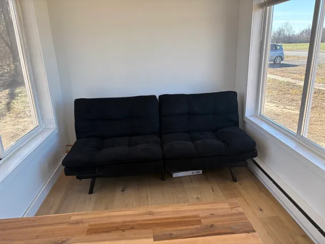 a view of livingroom with furniture and wooden floor