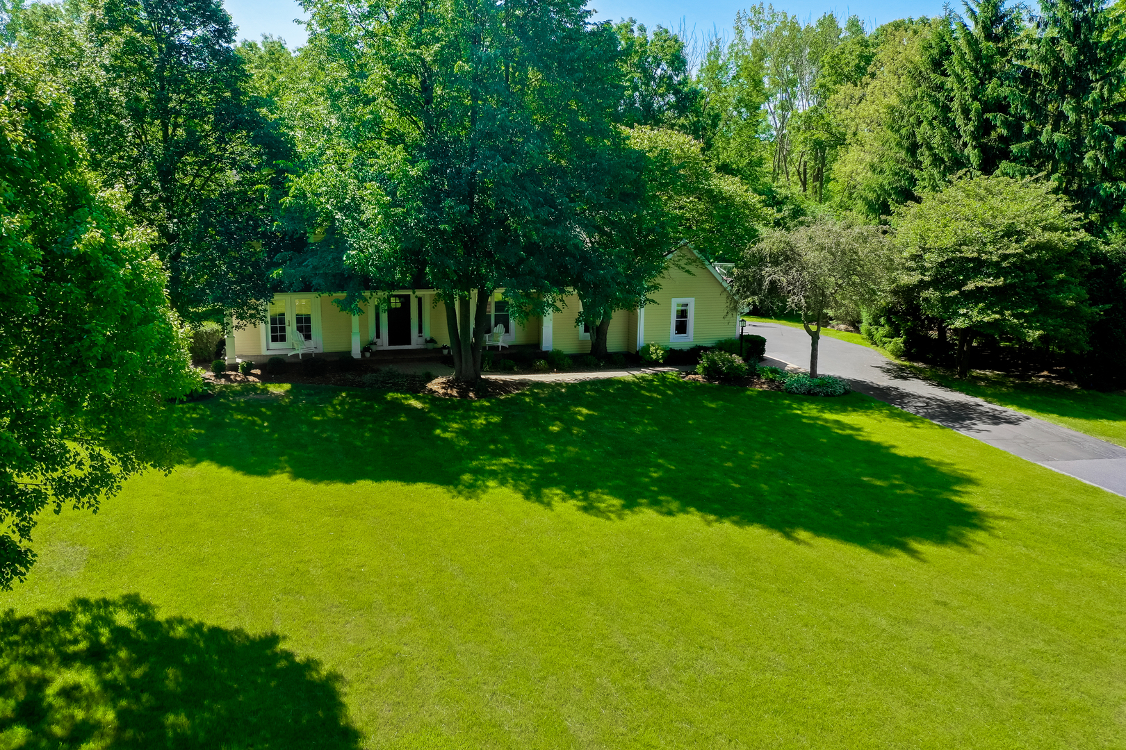 1760 Saddle Hill Road Libertyville, IL 60048 - Photo 23 of 28 a view of a house with a yard porch and sitting area