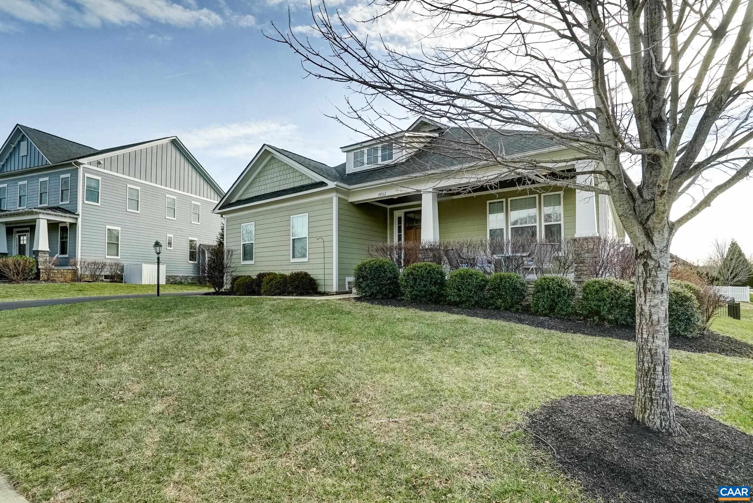 7652 Birchwood Hill Road Crozet, VA 22932 - Photo 1 of 64 a view of a white house next to a yard with big trees