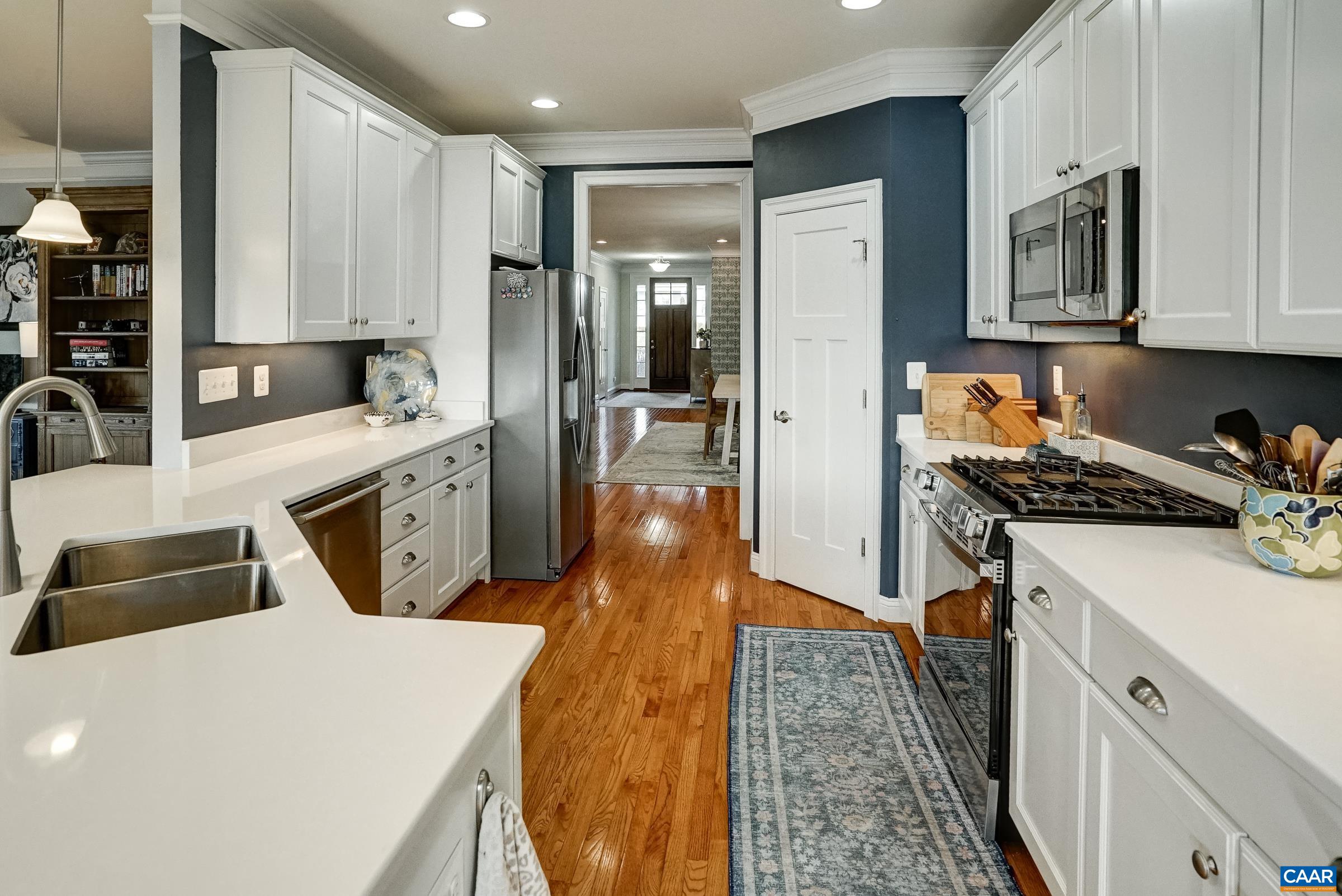7652 Birchwood Hill Road Crozet, VA 22932 - Photo 13 of 64 a kitchen with stainless steel appliances a sink stove and refrigerator
