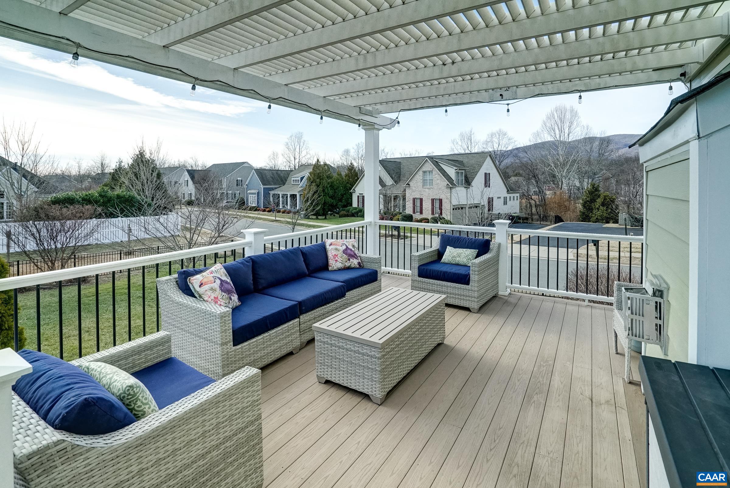 7652 Birchwood Hill Road Crozet, VA 22932 - Photo 23 of 64 a balcony with furniture and wooden floor