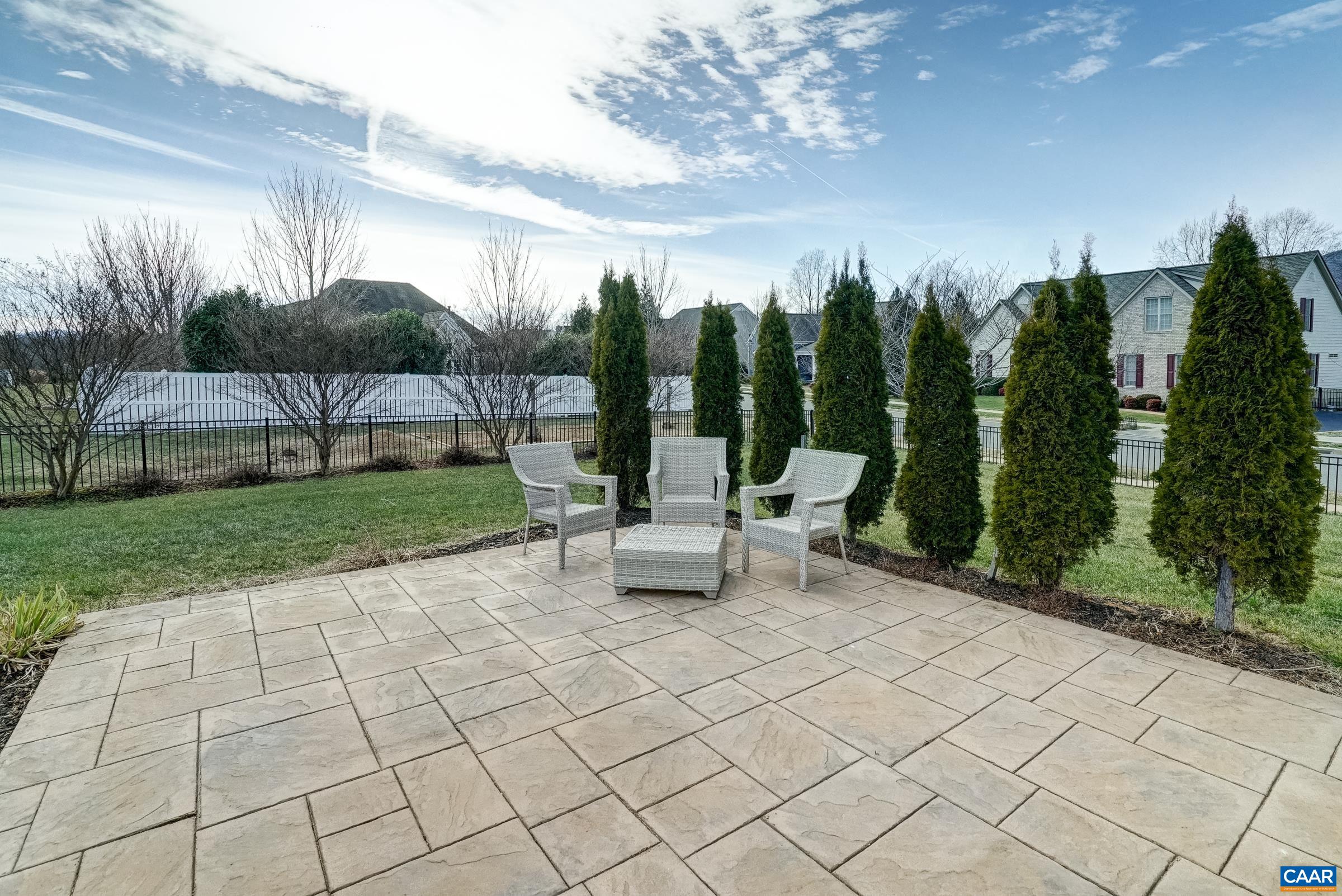 7652 Birchwood Hill Road Crozet, VA 22932 - Photo 24 of 64 Expansive stamped concrete patio with privacy screening in flat, fenced back yard.