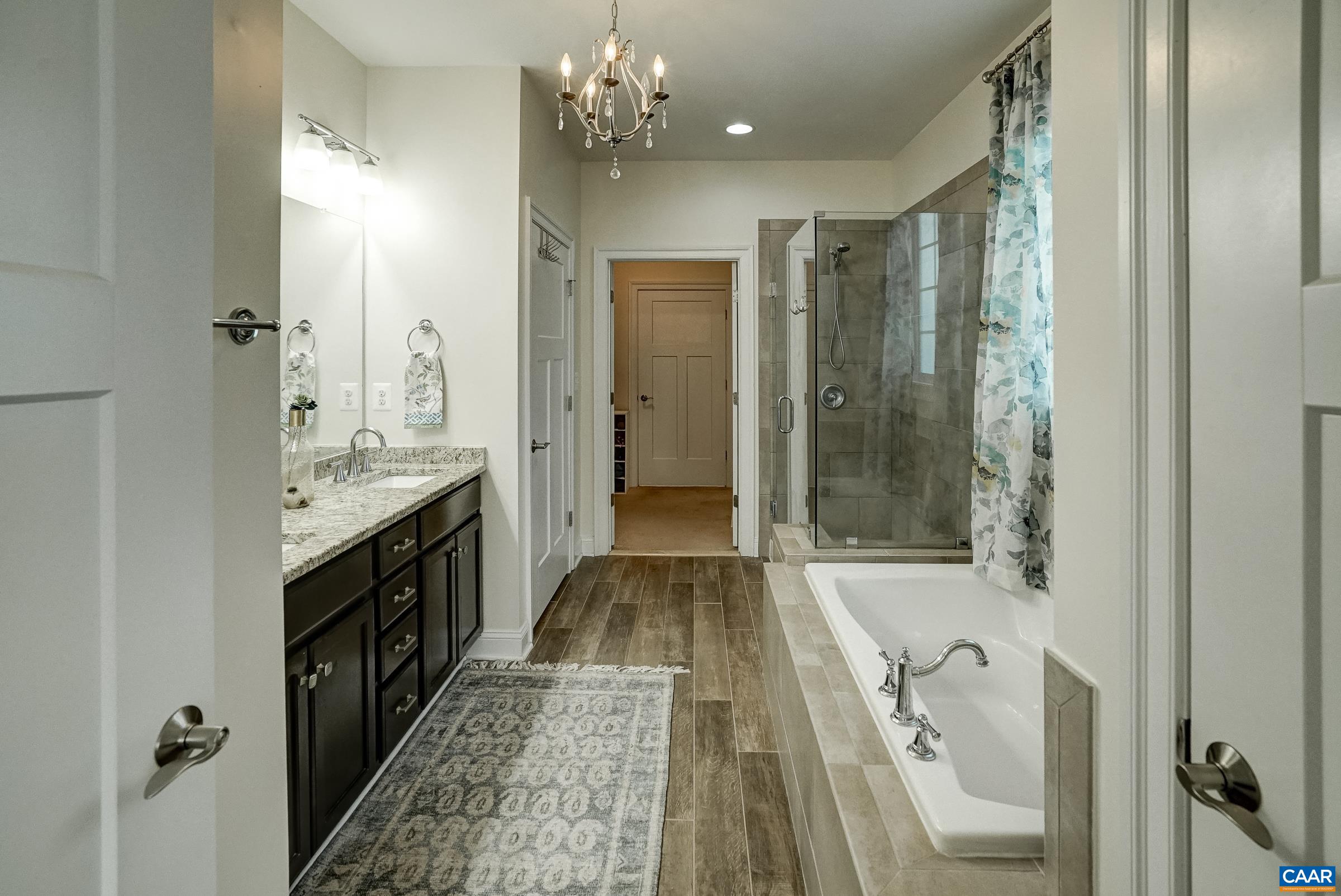 7652 Birchwood Hill Road Crozet, VA 22932 - Photo 28 of 64 a bathroom with a tub shower and sink