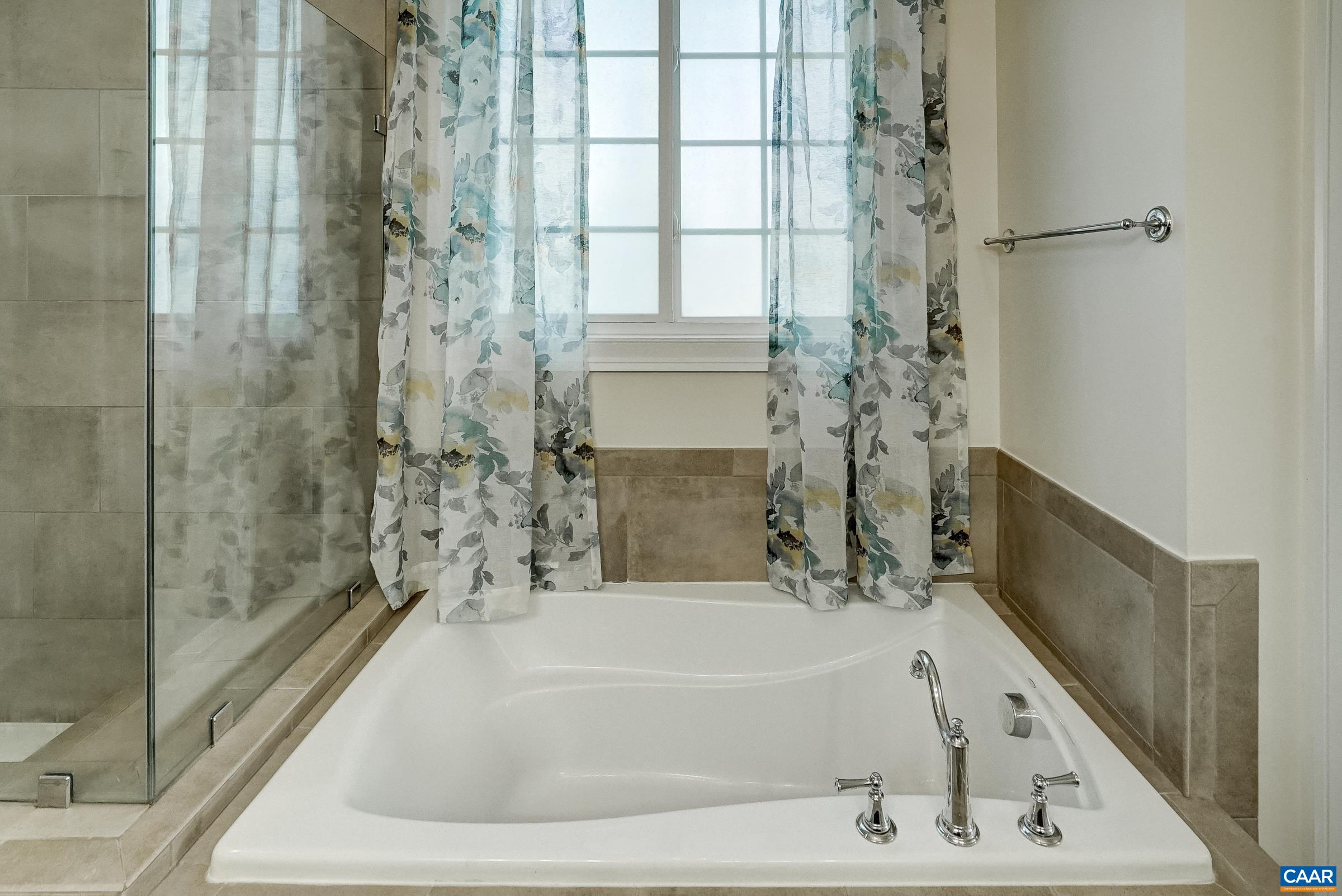 7652 Birchwood Hill Road Crozet, VA 22932 - Photo 30 of 64 a bathroom with a bathtub and shower