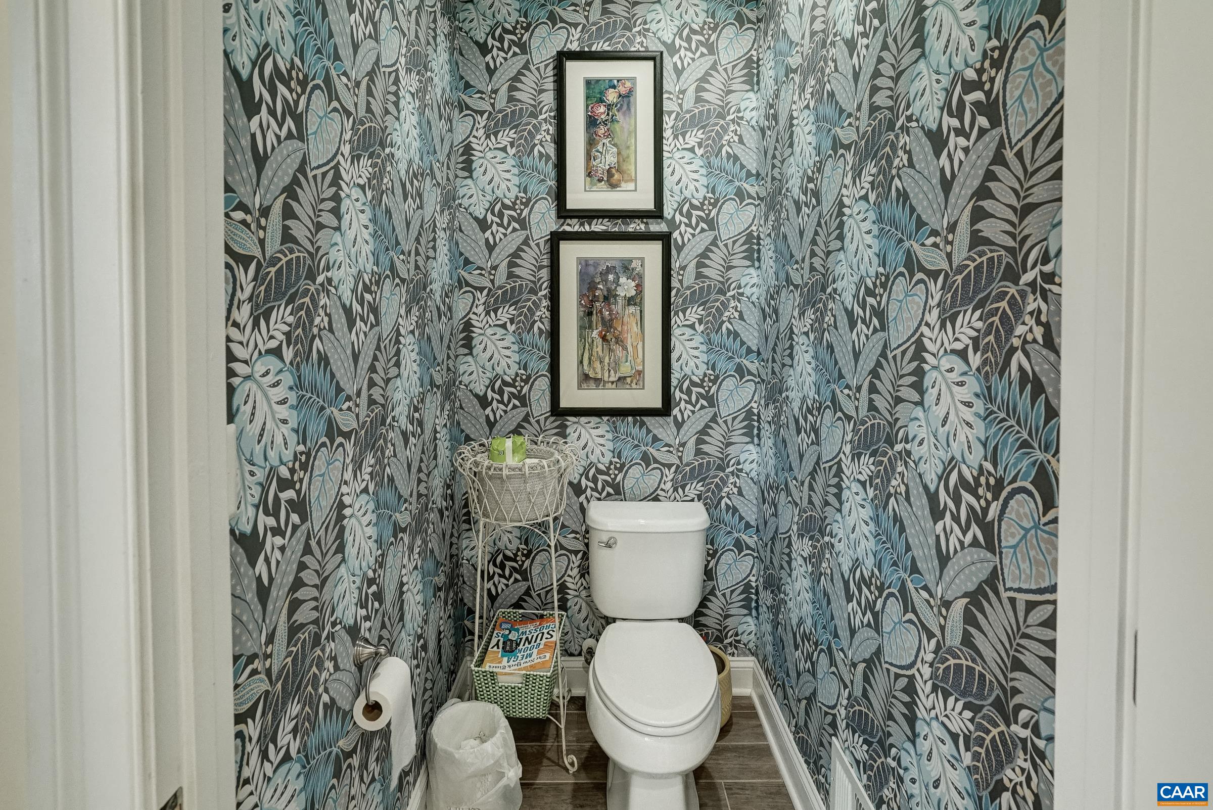 7652 Birchwood Hill Road Crozet, VA 22932 - Photo 32 of 64 a white toilet sitting next to a shower curtain