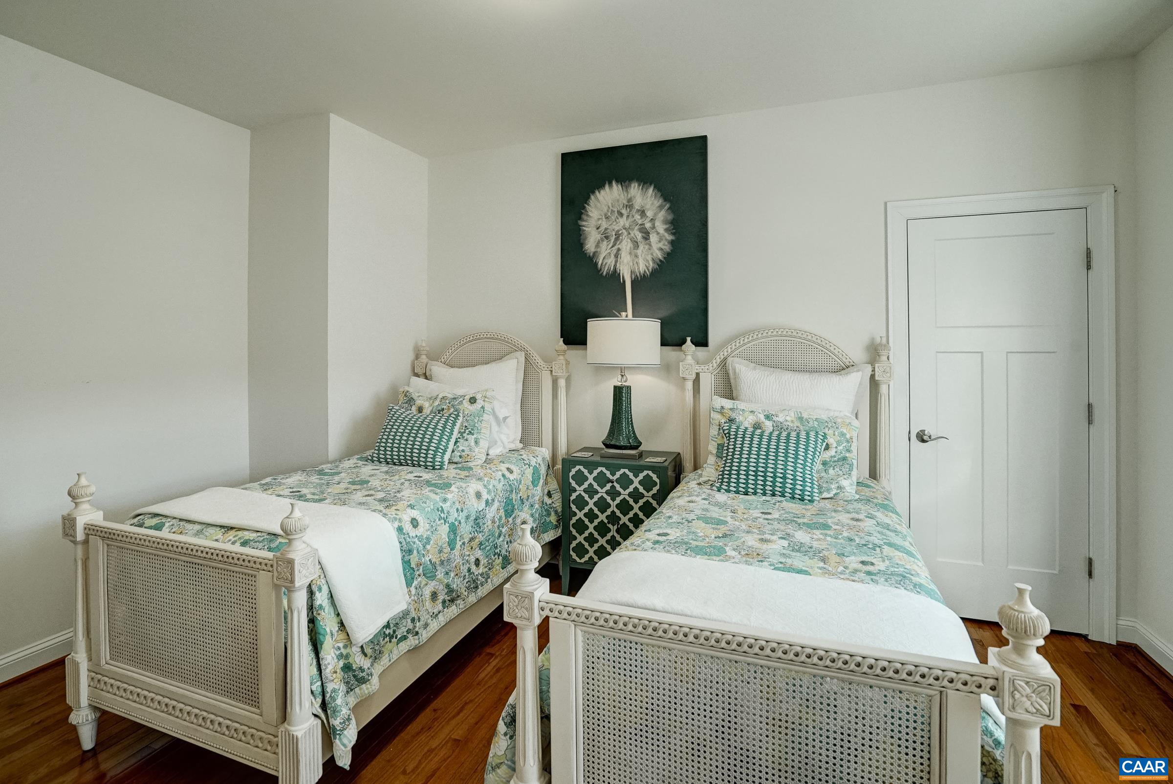 7652 Birchwood Hill Road Crozet, VA 22932 - Photo 38 of 64 a bedroom with a bed and a table in it