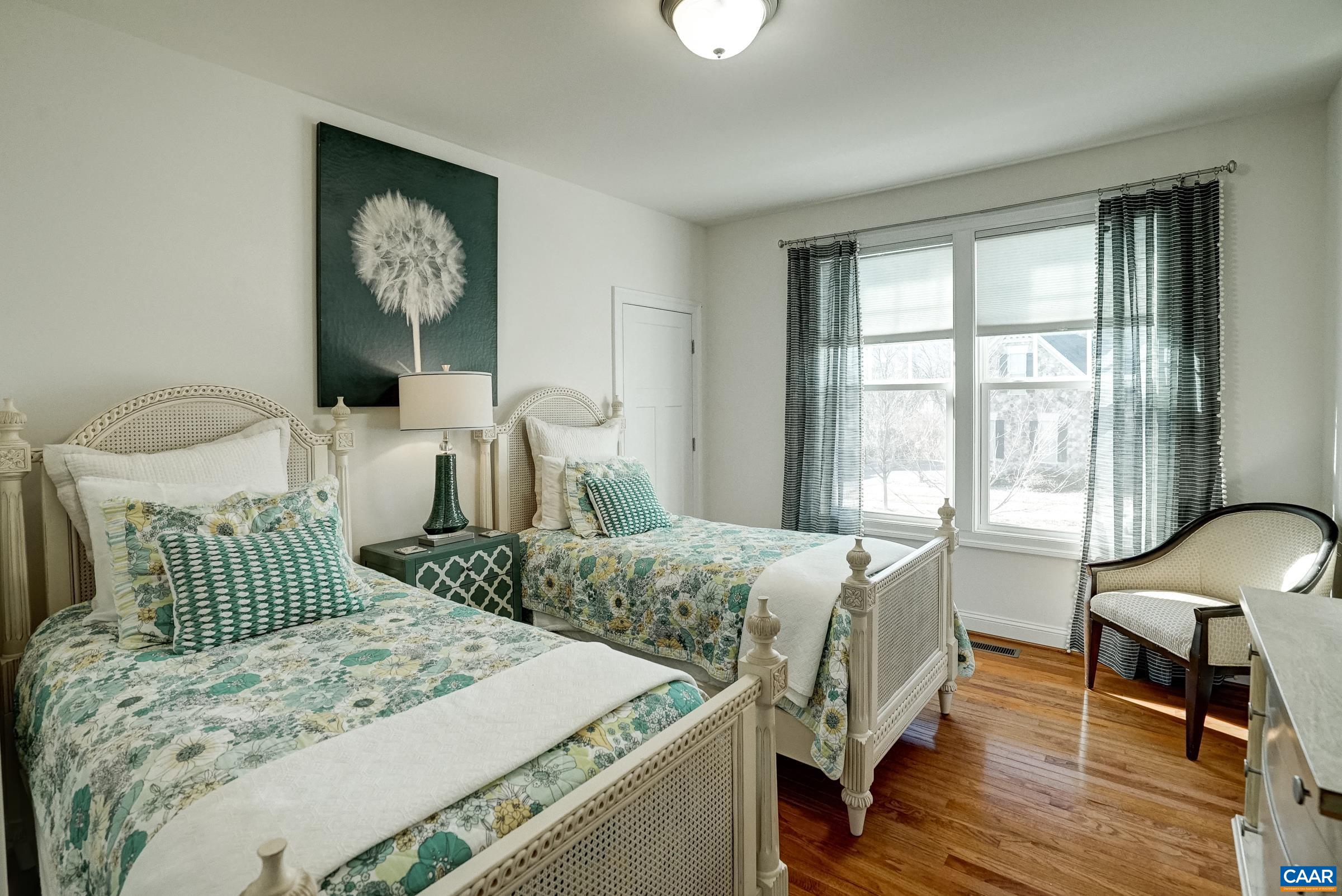 7652 Birchwood Hill Road Crozet, VA 22932 - Photo 39 of 64 a bedroom with a bed and wooden floor