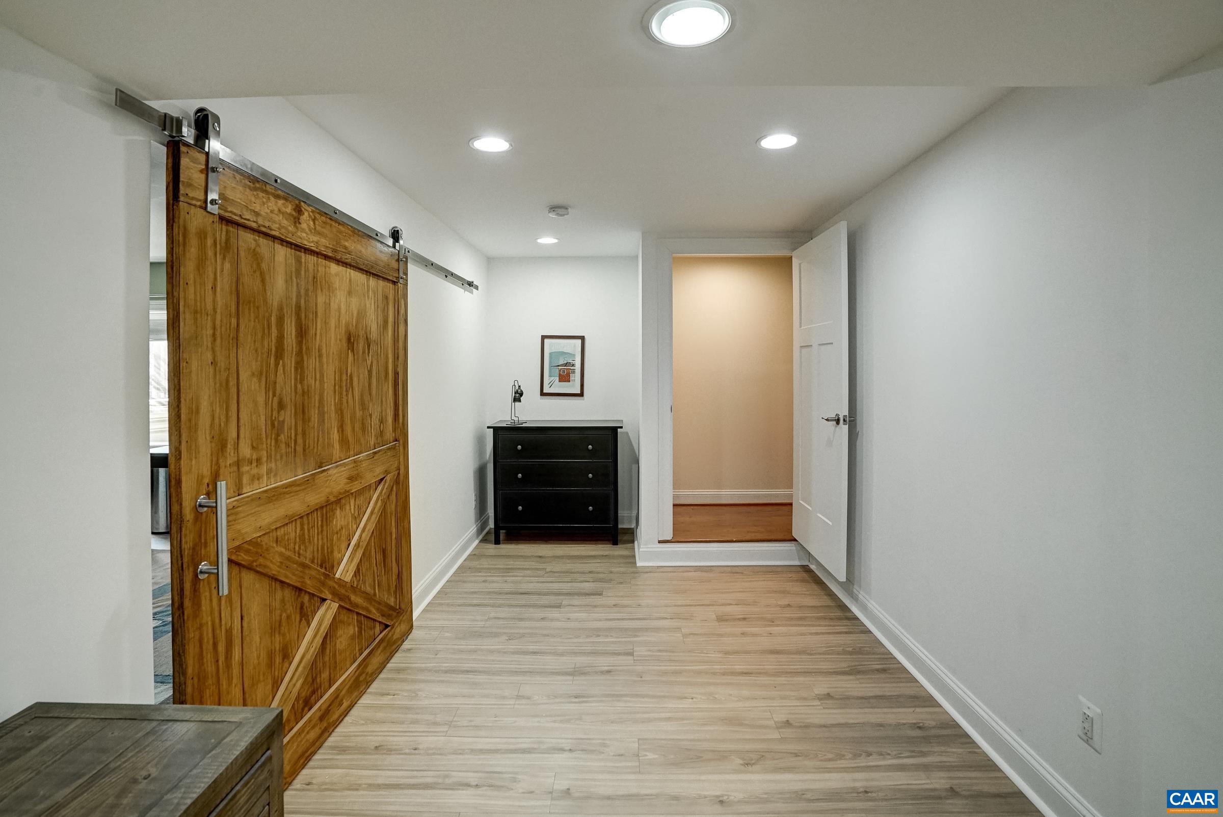 7652 Birchwood Hill Road Crozet, VA 22932 - Photo 42 of 64 Walk-up lower level features luxury vinyl plank flooring throughout.