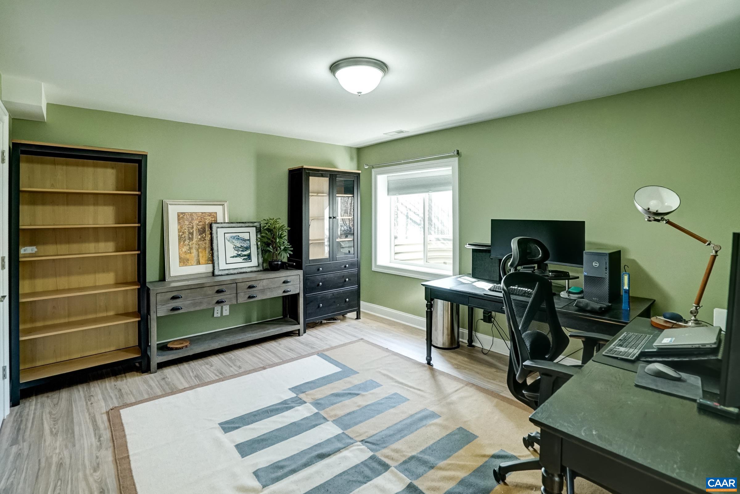 7652 Birchwood Hill Road Crozet, VA 22932 - Photo 47 of 64 a room with furniture and a flat screen tv