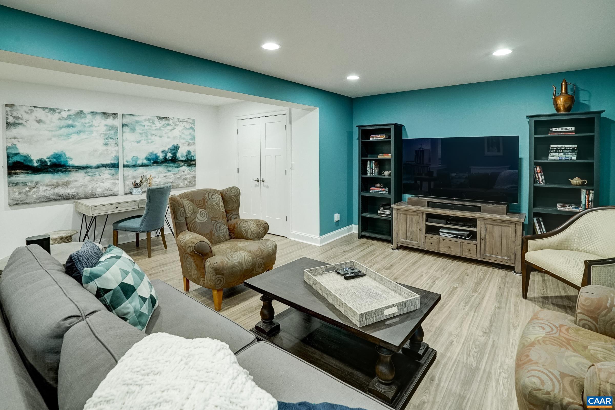 7652 Birchwood Hill Road Crozet, VA 22932 - Photo 49 of 64 a living room with furniture and a flat screen tv