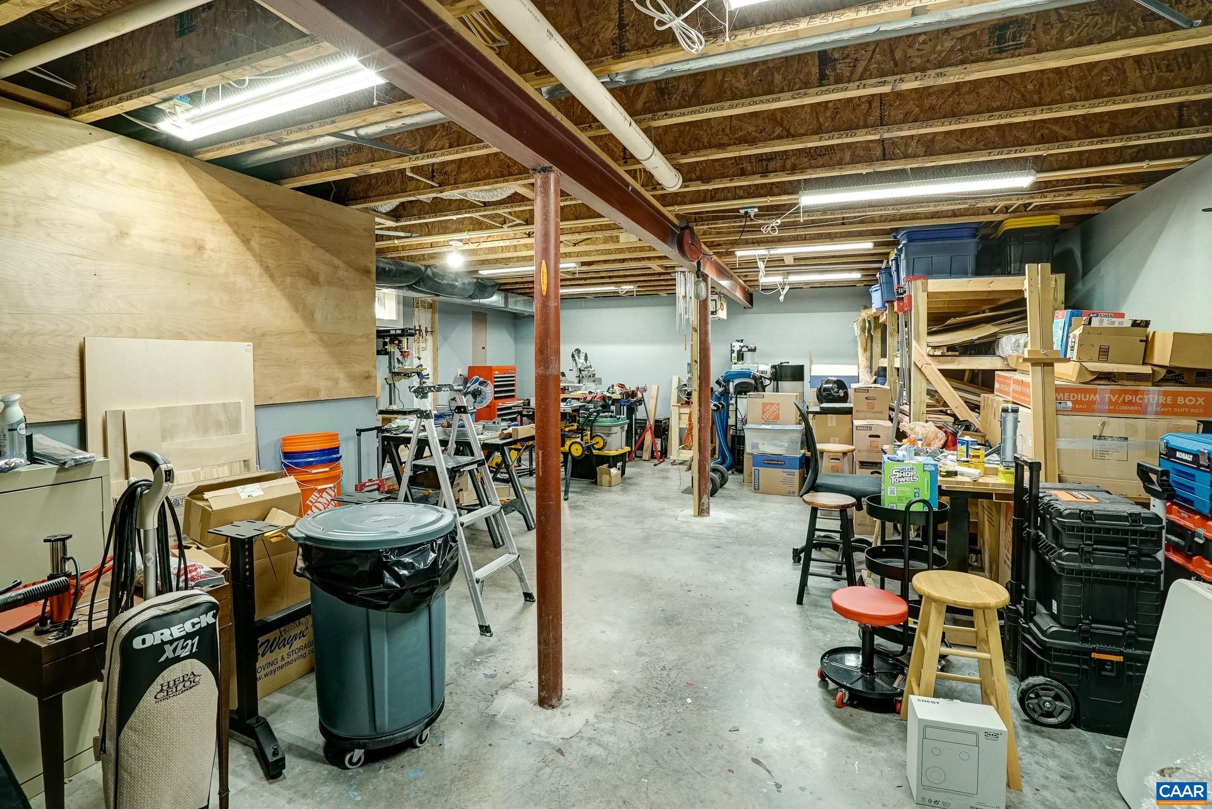 7652 Birchwood Hill Road Crozet, VA 22932 - Photo 52 of 64 Huge workshop area with built-in storage shelving.